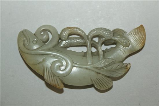 A Chinese pale celadon and russet jade carving of a fish, 19th century, 6.5cm